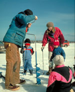 Photo of a family doing ice-fishing